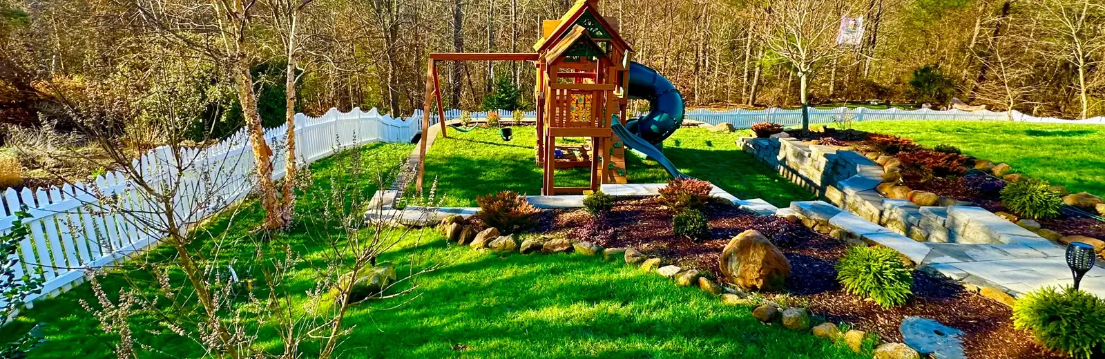 back yard with green healthy lawn